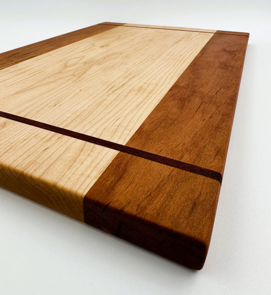 Maple Cutting Board with Cherry Edging and Purple Heart Inlay